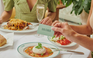 Firefly Gemini Flash A Womans Hand Holds The San Carlo Credit Card Which Is Mint Green In Front Of The 135107