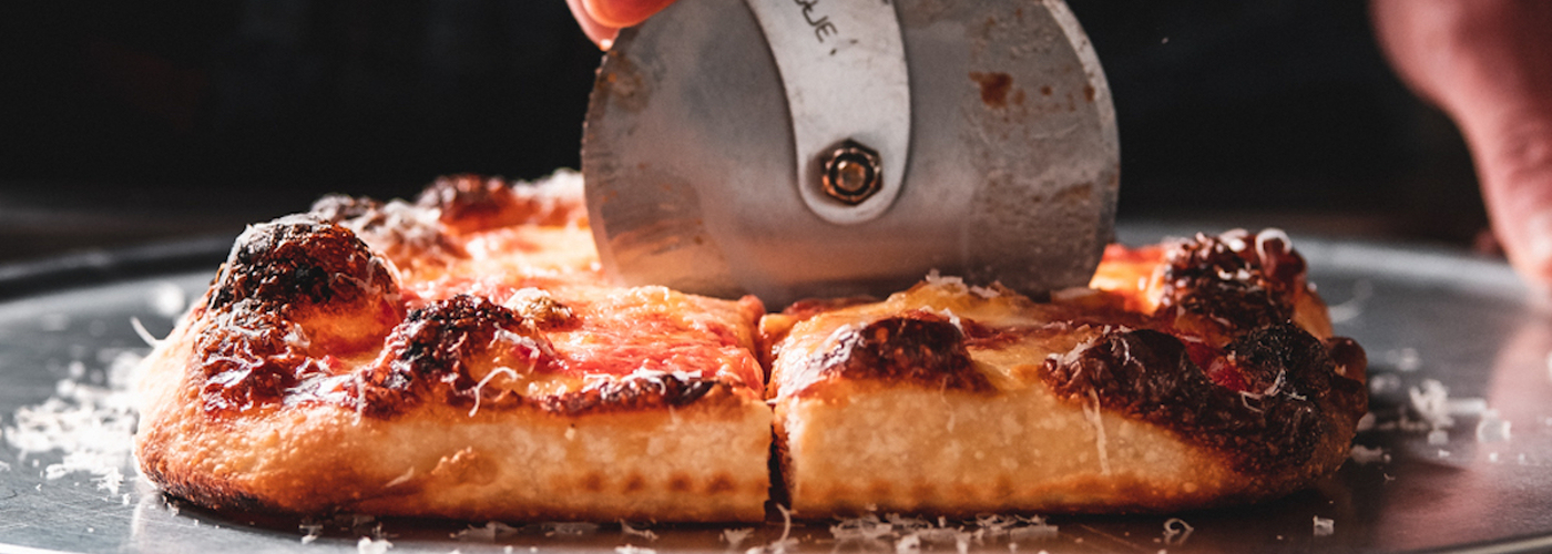 2021 02 24 Header Nells At Home Square Pizza Being Cut By Hand