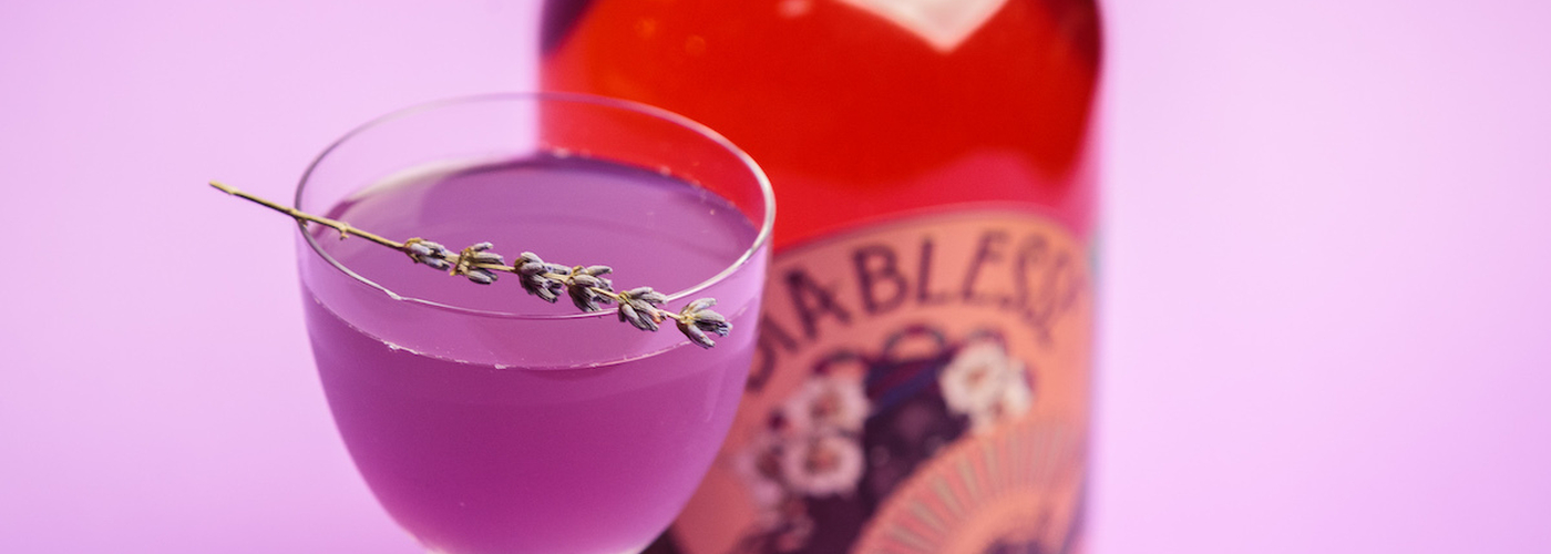 Purple Cocktail With Lavender And A Bottle Of Diablesse Rum