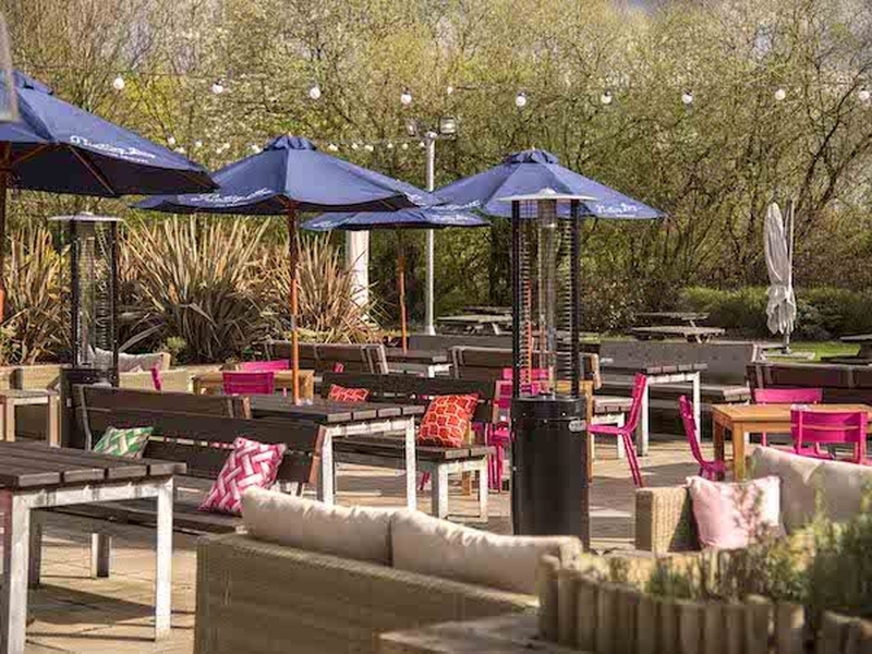 Terrace With Umbrellas Chairs And Sofas At Pointing Dog Cheadle