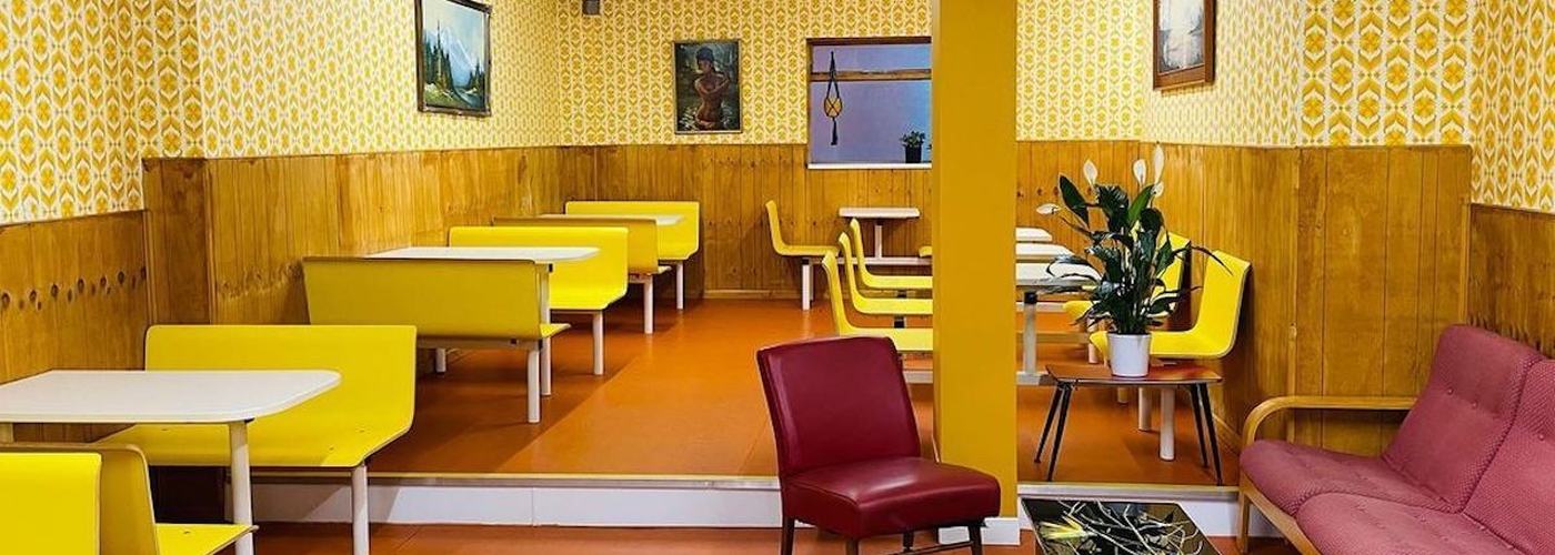 Sammys Retro Cocktail Bar With Yellow Seating And Patterned Wallpaper Manchester 800X1200