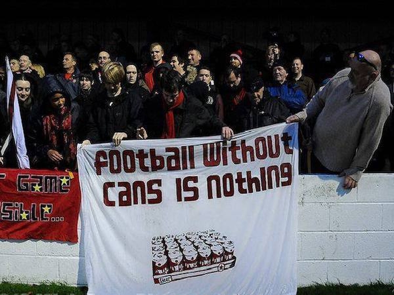 Fans Hold Up A Football Without Cans Is Nothing Sign At A Local Match