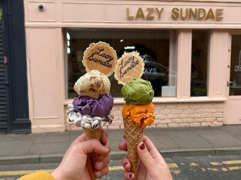 Hands Holding Colourful Ice Cream Cones Outside Lazy Sundae On Tib Street In The Northern Quarter Manchester