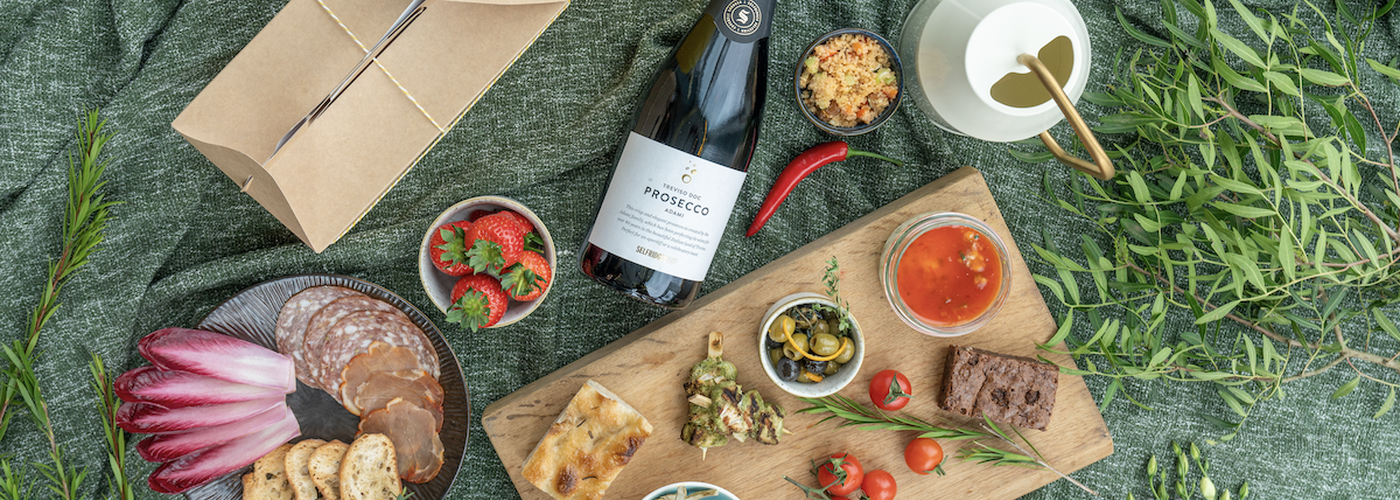 Selfridges Trafford Picnic With Prosecco And Mezze Laid Out On A Rug Header