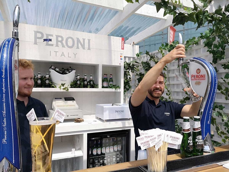 Barmen Serving Pint Of Peroni At Festa Italiana Manchester