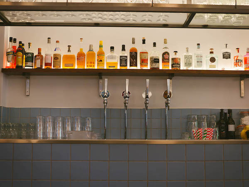 The Bar Lined With Spirits And Counter Top At Mustard Diner In Altrincham Manchester