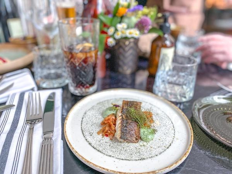 A Starter Of Scorched Mackerel On A Table With Drinks And Flowers At The Newsly Refurbished Black Friar Pub Salford