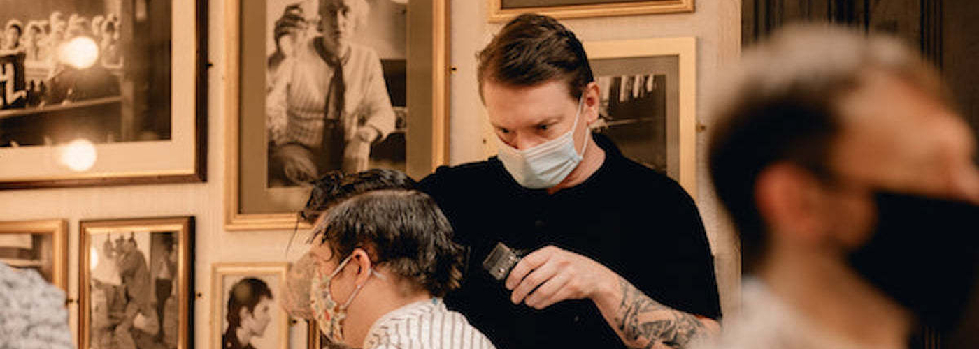 Barbers Hard At Work At Manchesters Barber Barber In Barton Arcade