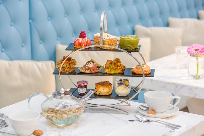 San Carlo Gran Cafe Afternoon Tea On A Cake Stand With Glass Teapot And White Tea Cups