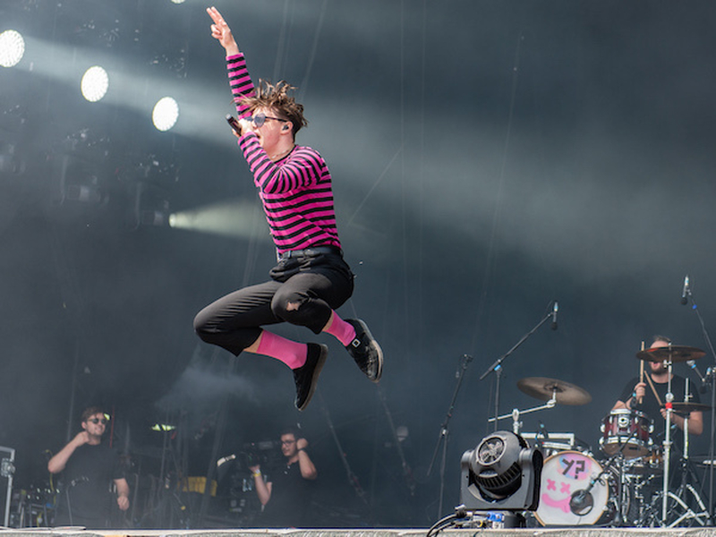 Yungblud Jumps On Stage At Rock Am Ring Wearing A Pink Striped Top And Pink Socks And Will Headline Manchester Pride This Year