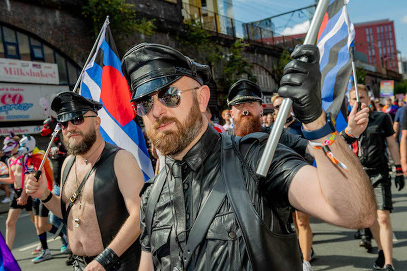 Men In Leather Hats Holding Flags March At Manchester Pride Protest 2021 Chris Keller Jackson