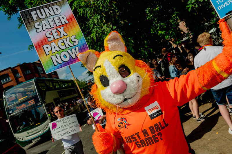Someone In A Tiger Outfit With A Sign Saying Fund Safer Sex Packs Now Protests At Manchester Pride Protest 2021 Chris Keller Jackson