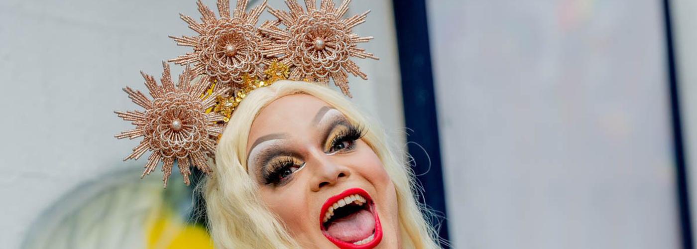Drag Queen In Blonde Wig With Copper Crown Throws The Peace Sign And Smiles At Manchester Pride 2021 Chris Keller Jackson 1200 800