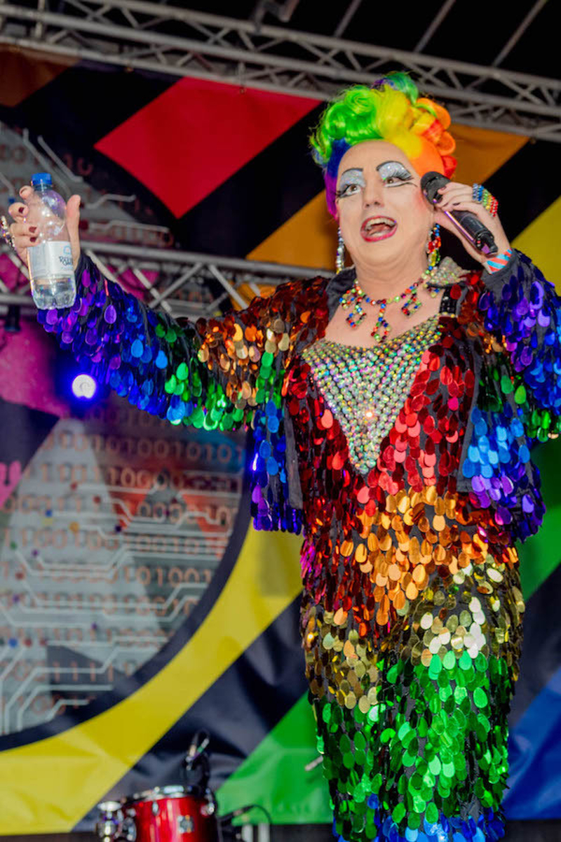 A Drag Queen In A Rainbow Sequin Dress And Rainbow Wig On The Alan Turing Stage At Manchester Pride 2021 Chris Keller Jackson