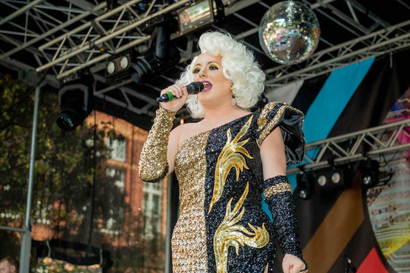 A Drag Queen In Black And Gold Sparkles Alan Turing Stage At Manchester Pride 2021 Chris Keller Jackson