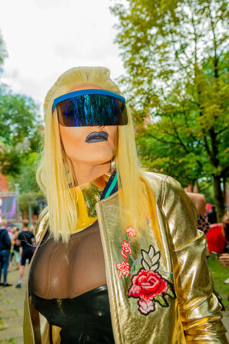 Drag Queen With Blonde Wig Blue Visor And Blue Lipstick At Manchester Pride 2021 Chris Keller Jackson