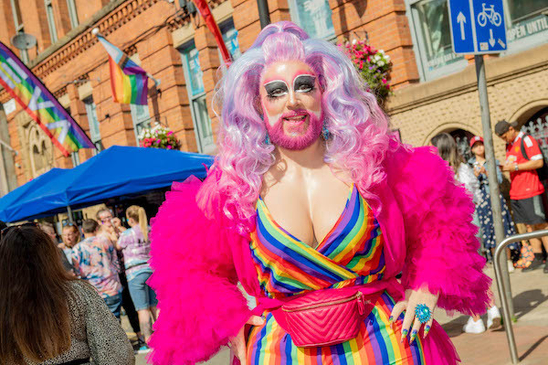 Drag Queen In Rainbow Dress And Pink Shrug And Pink Wig And Pink Beard At Manchester Pride 2021 Chris Keller Jackson