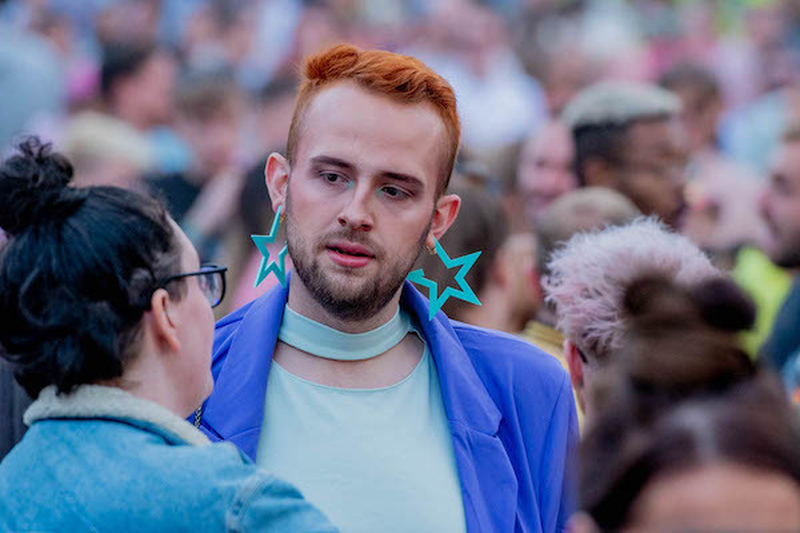 A Person With Ginger Hair And Blue Star Earrings At Manchester Pride 2021 Chris Keller Jackson