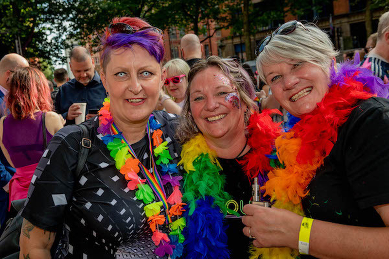 Women With Colourful Hair And Rainbow Feather Boas Smile At Manchester Pride 2021 Chris Keller Jackson