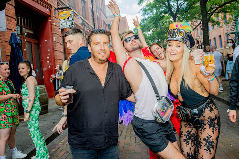 People Stirke A Pose In The Street With Pride Hat At Manchester Pride 2021 Chris Keller Jackson