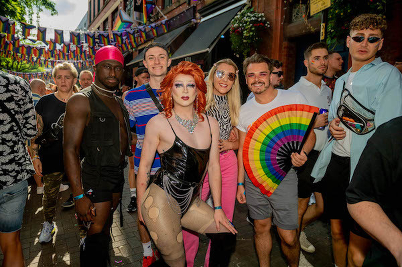 A Group Of Confident Looking People In Leather And Fihnet With Rainbow Fan On Canal Street At Manchester Pride 2021 Chris Keller Jackson