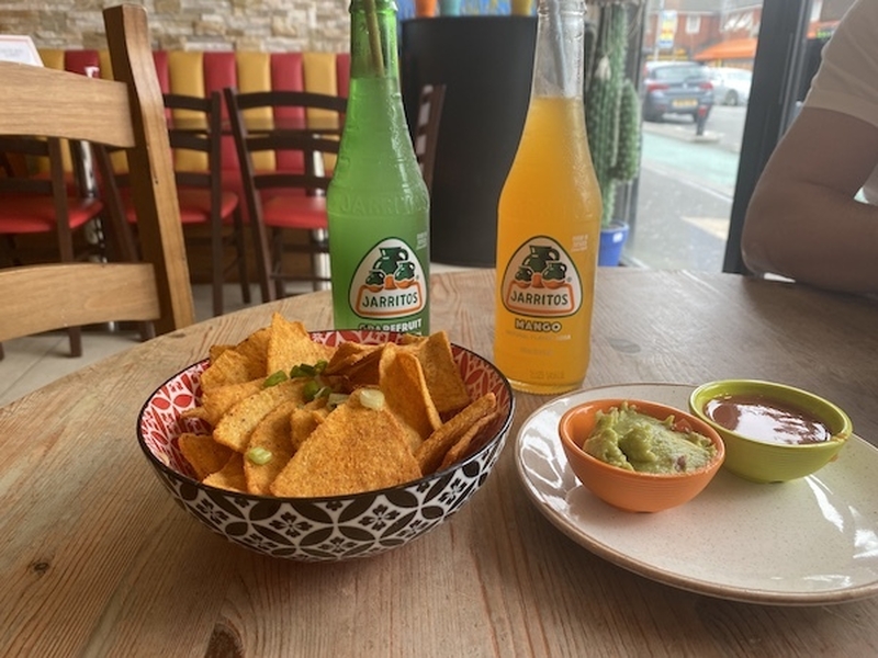Tortilla Chips Guacamole Salsa And Two Bottles Of Jarritos Mexican Soda At Don Tacos Rusholme Manchester