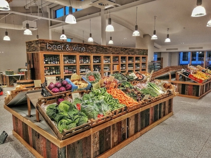 Fresh Vegetables On Display In Wooden Stands At Hinchcliffes Farm Shop In Huddersfield