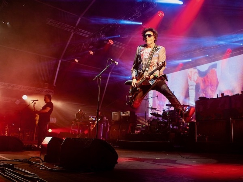 The Manic Street Preachers Perform Onstage Bass Guitarist Nicky Wire Leaping Into The Air