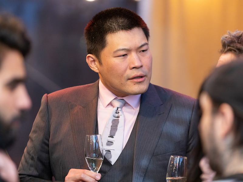 Terry Huang Of Umezushi Drinks Champagne At Manchester Food And Drink Awards 2021