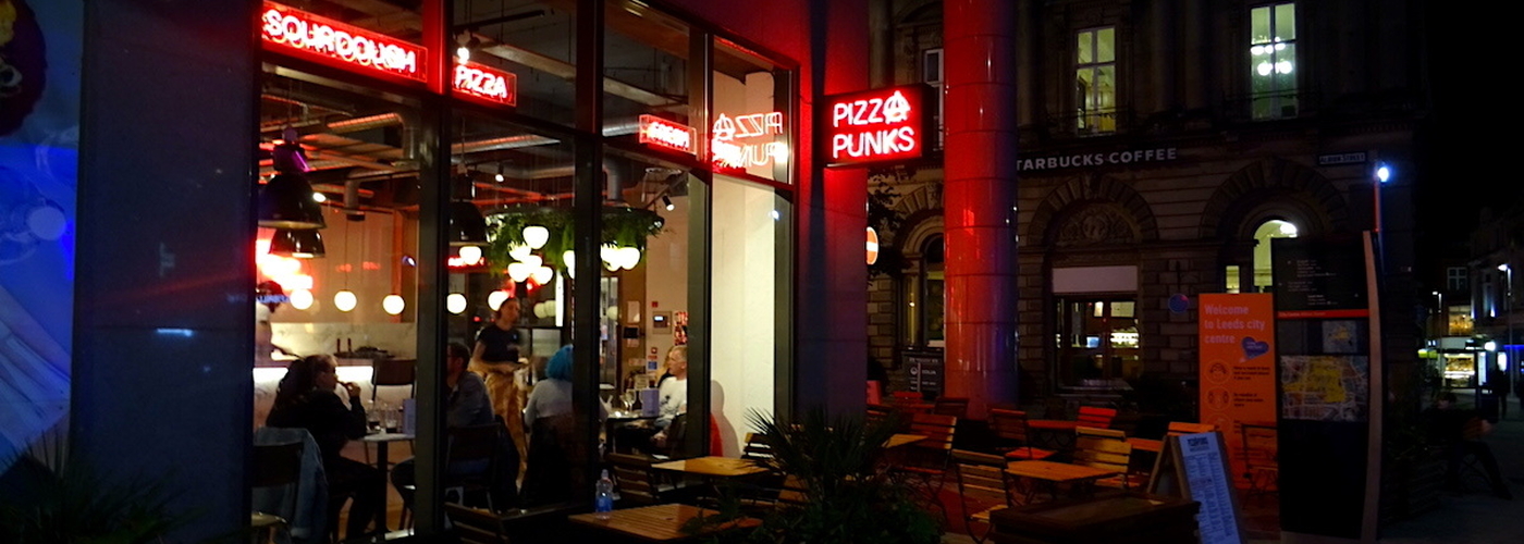 The Aggressive Neon Of The Exterior Of Pizza Punks On Bond Street In Leeds