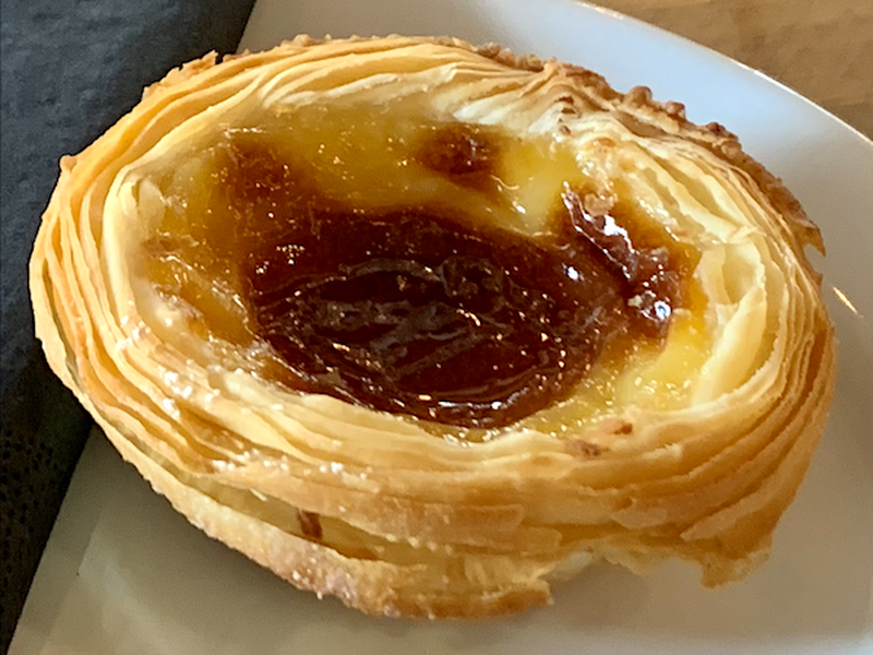 A Pastel De Nata With Distinct Layers Of Pastry And Burnished Custard From 200 Degrees Coffee In Manchester