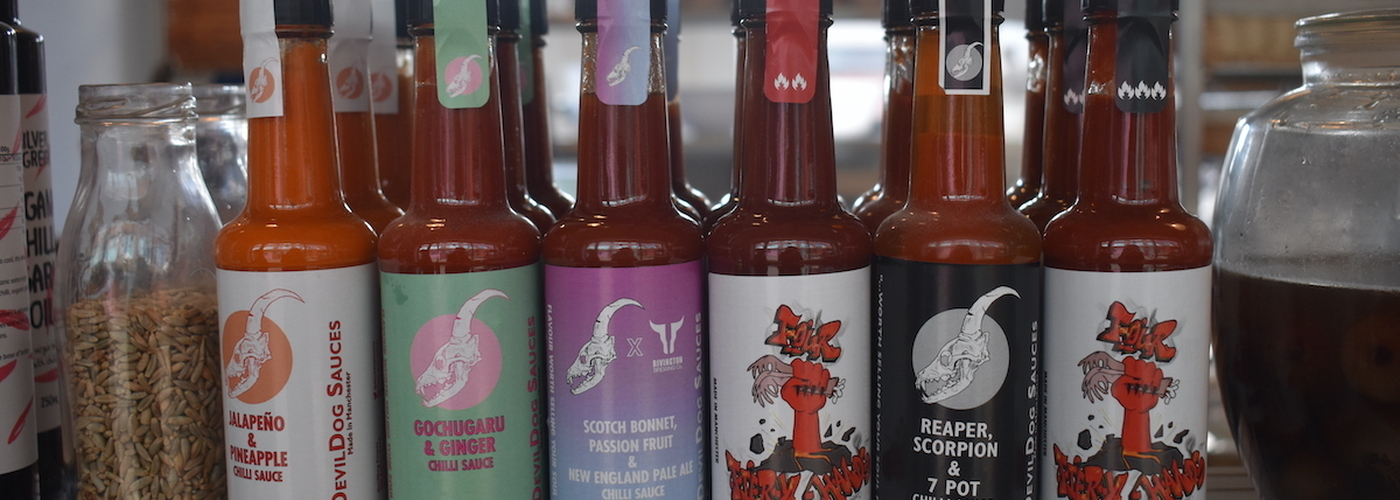 A Line Up Of Devil Dog Hot Sauces At 3 Hands Deli In Manchester Including Some Collaborative Sauces