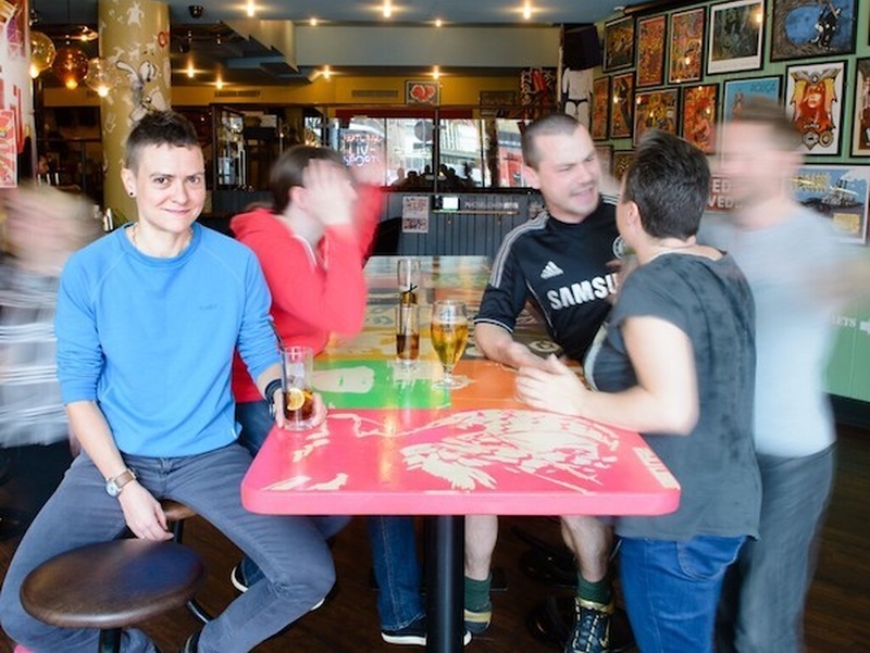 Group Of Friends In A Pub Drinking Beer