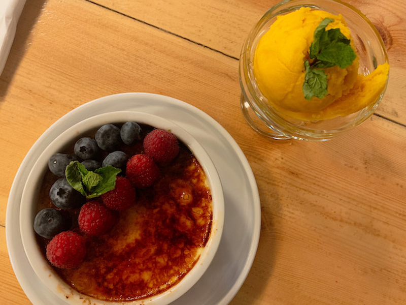 A Mango Sorbet And A Creme Catalana Topped With Berries At Off The Grid A Mediterranean Inspired Grill Restaurant In Chorlton Manchester