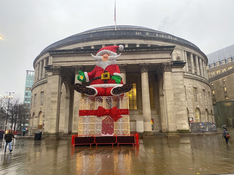 Santa Claus Outside The Library In Manchester In The Rain
