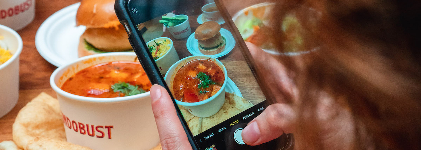 Taking A Photo Of A Table Of Food At Bundobust Brewery
