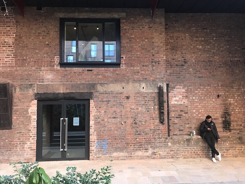 The Side Of The Great North Pie Co Site At Kampus In Manchester Which Looks Out At The Courtyard And Has Ample Space For Seating