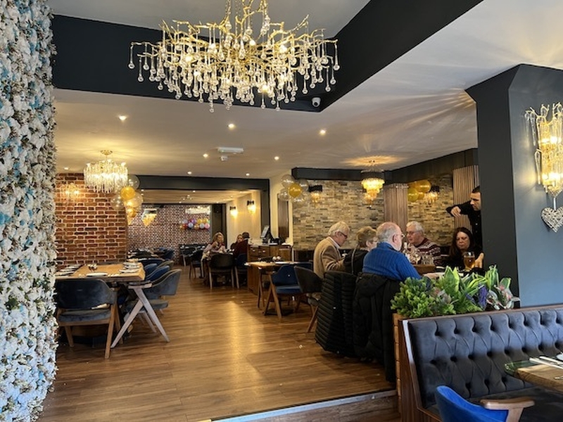 Chandeliers Flower Wall And Seating Area Inside Zeugma Turkish Restaurant Didsbury Manchester