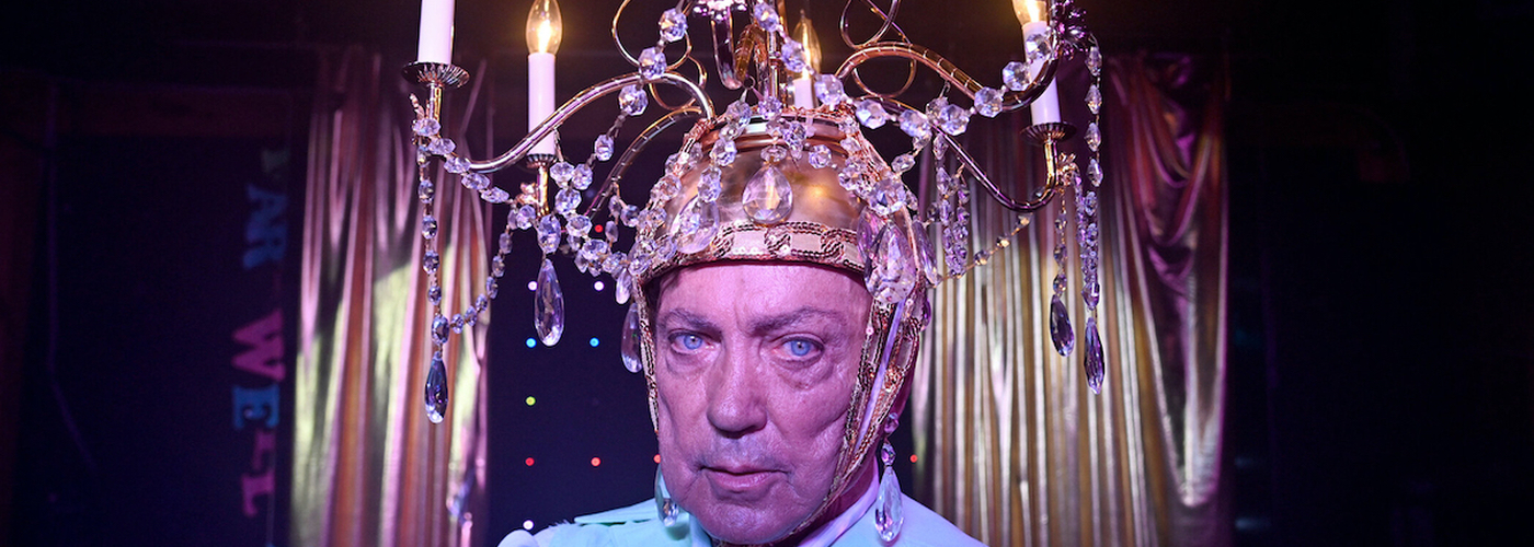 An Older White Man With A Chandelier On His Head Which Is A Still From The Film Swan Song That Will Be Shown At Manchester Film Festival 2022