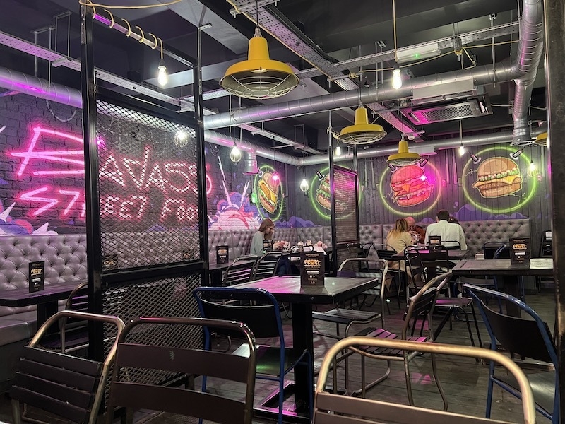 Interior With Graffiti And Cages At Frost Burgers Portland Street Manchester