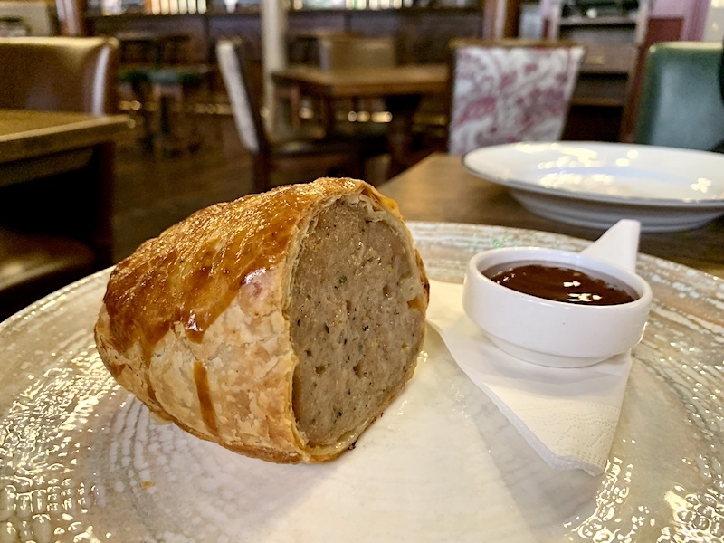 A Sausage Roll With Brown Sauce From The Fountain House On Albert Square In Manchester