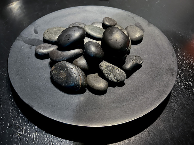 A Plate Of Black Pebbles At Home Granary Wharf Leeds