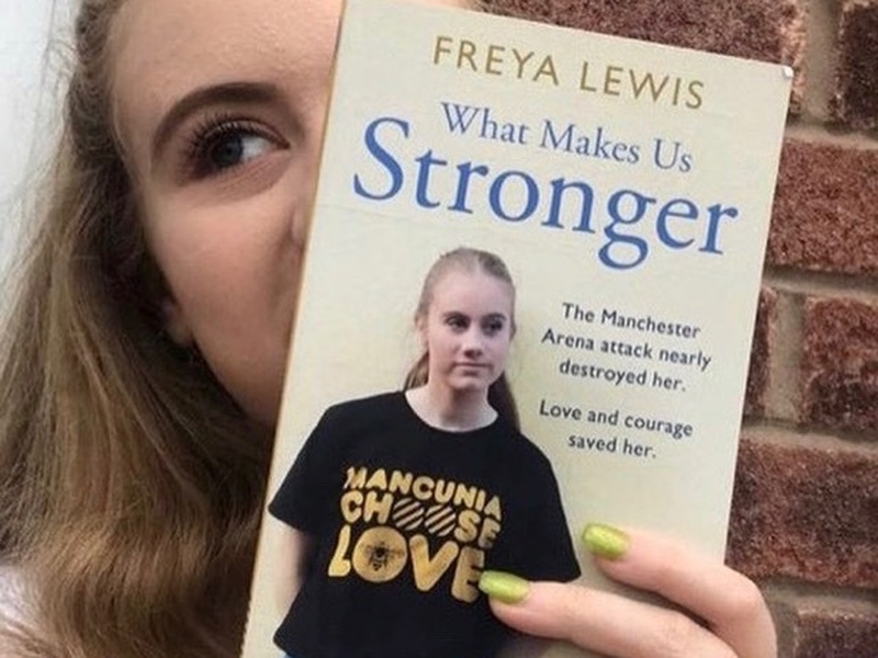 Freya Lewis with her book What Makes Us Stronger