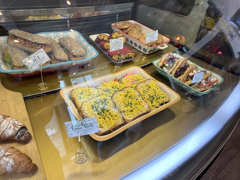 A Counter Full Of Lunch Options Like Chickpea Tuna Melt Salmnot Bagel And Coronation Cauli Wrap At The Vibe Plant Based Cafe Liverpool