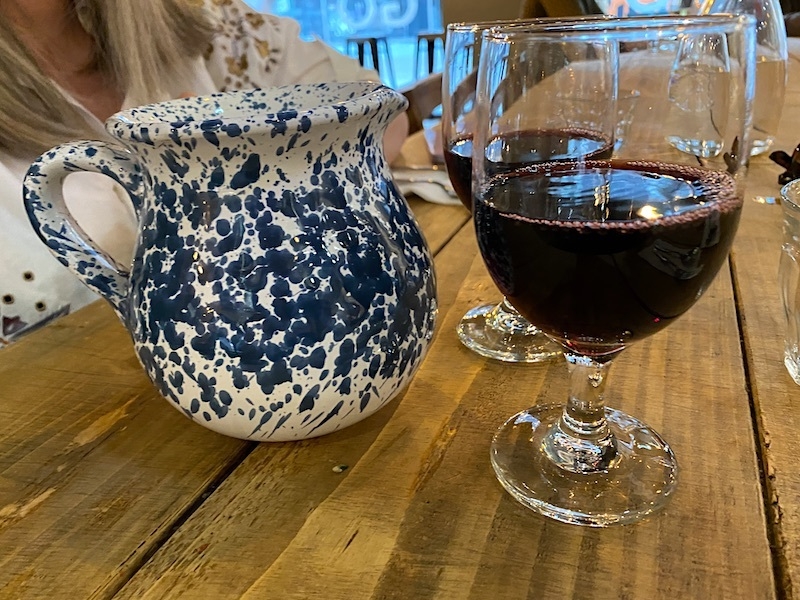 Wine And Pretty Painted Jug At Sugo Pasta Kitchen In Sale Manchester