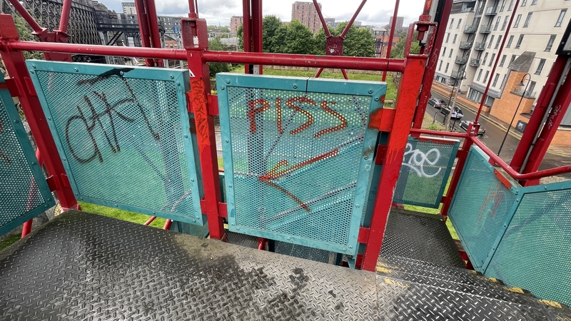 The original and vandalised paint job on the Castlefield stairs