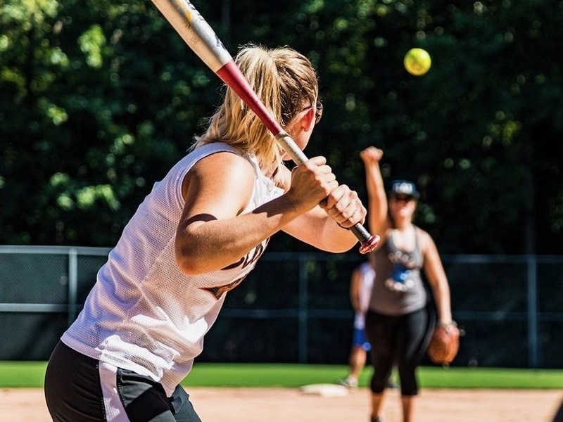 Girl playing baseball from Wythenshawe Games website
