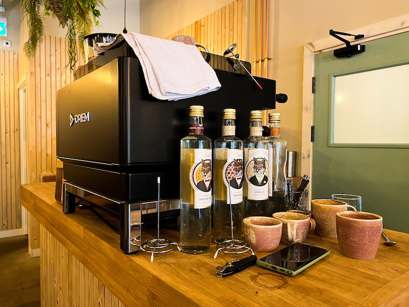 Coffee Maker With Mugs And Syrups At Greens In Sale