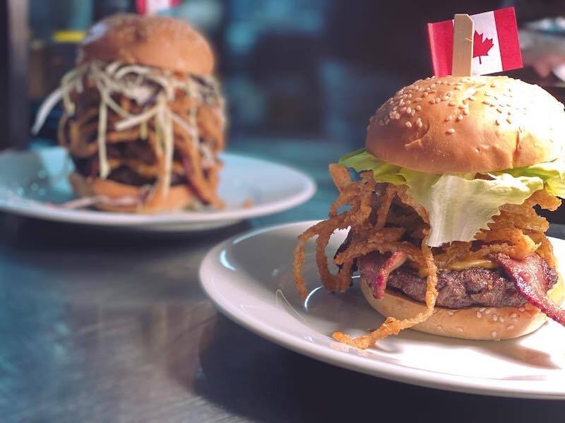 Two Large Burgers With Canadian Flag Pick From Cowtown Grill In Sale