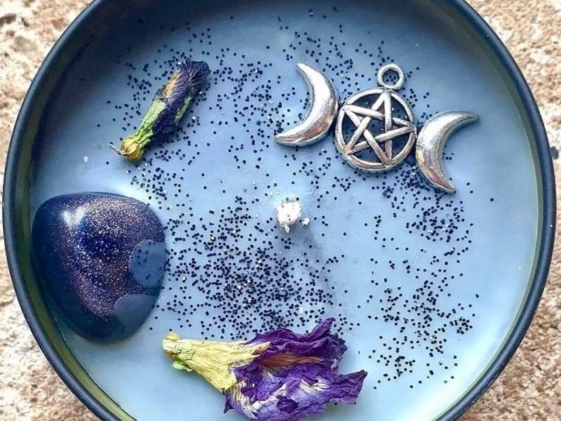 Blue witchy candle for wellbeing festival